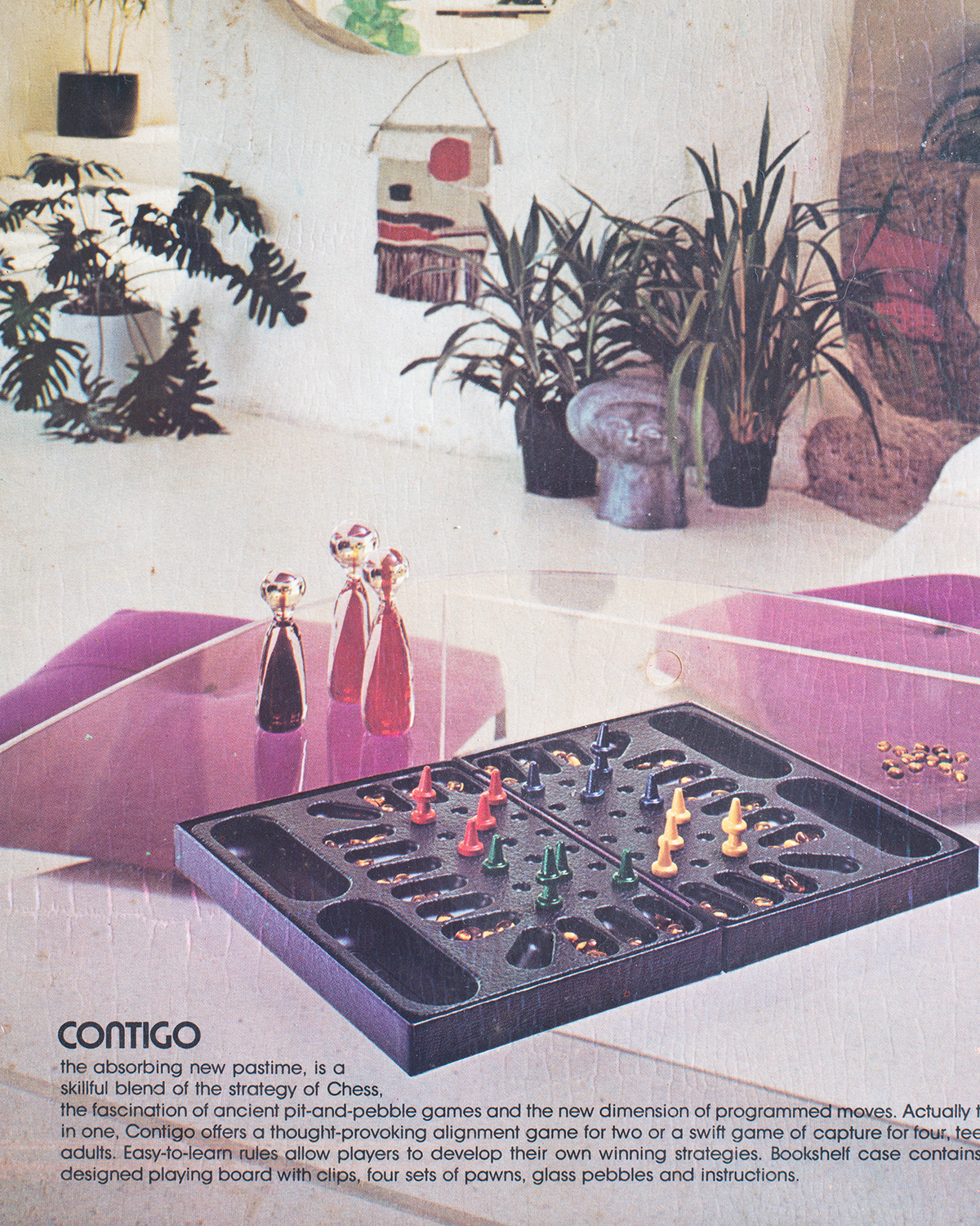 A vintage product advertisement for the Contigo Contingency Alignment Game, showing the black plastic game tray with colorful wooden and glass pieces, a matching black storage case, and several decorative glass goblets on a purple surface in a modern living room setting.