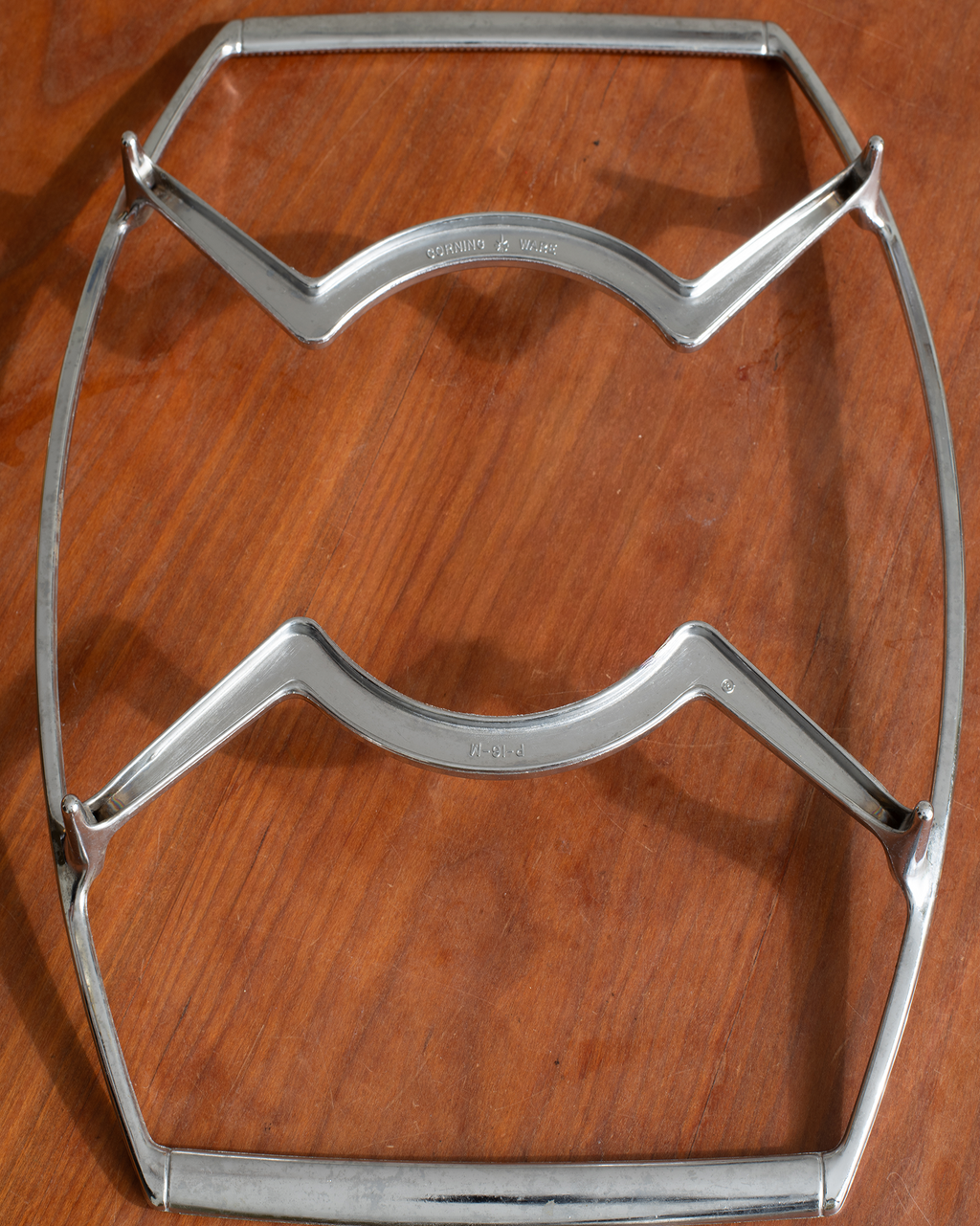 A vintage polished steel table stretcher with a 'Tinsley & Co. Ltd.
