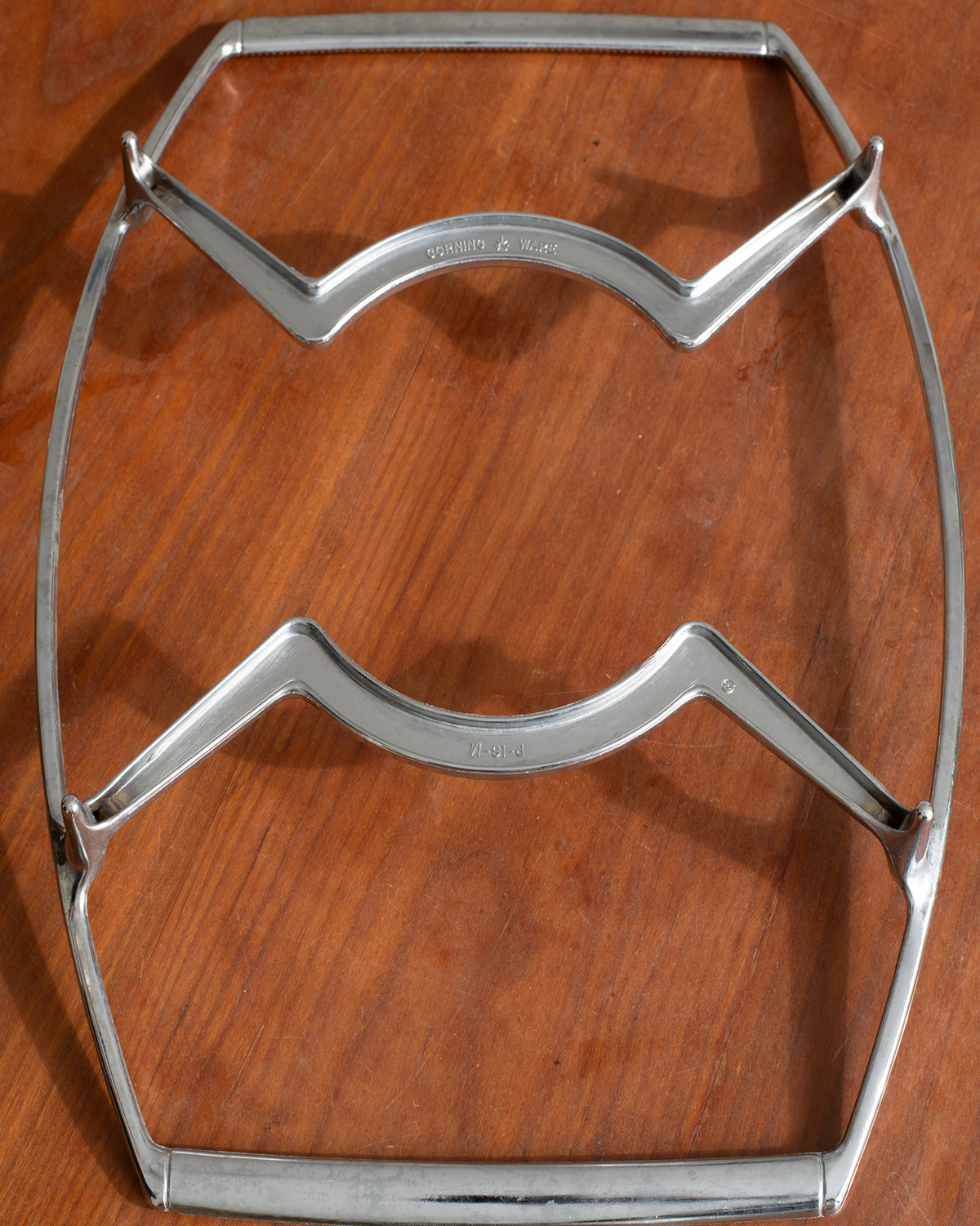 A vintage polished steel table stretcher with a 'Tinsley & Co. Ltd.